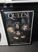 A large framed Queen poster measuring 69cm x 98cm