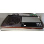 A Bang and Olufsen Beocentre with console / remote