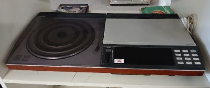 A Bang and Olufsen Beocentre with console / remote