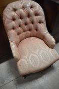 A Victorian mahogany framed button back fireside chair, width approx. 60cm