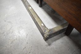 A traditional brass fire fender, internal dimensions 122 x 30cm