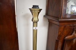 A modern brass effect standard lamp