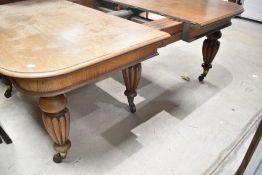 An impressive Victorian oak extending dining/banquetting table, by Bell & Coupland, Preston, stamped