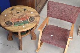 A vintage child's rocking chair and novelty occasional table