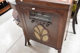 A early 20th Century mahogany cased radiogram , with composite parts including HMV, Philips, and