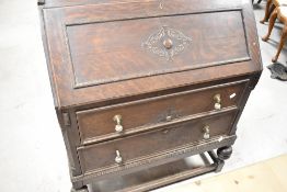 An early 20th Century oak bureau, width approx. 87cm