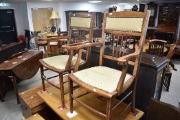 A pair of late Victorian or Edwardian spindle back salon armchairs