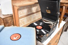 An early 20th Century HMV portable gramophone , and accesories including needles and Puccini Tosca