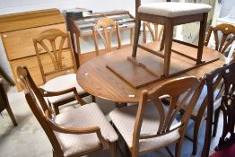 A modern extending dining table and set of eight (six plus two) dining chairs, labelled Homestead (