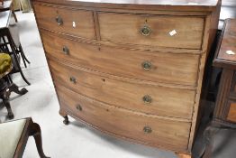 A late 19th or early 20th Century mahogany chest of two short over three long drawers, having bow