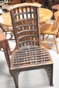 An interesting teak stained garden chair of lattice design