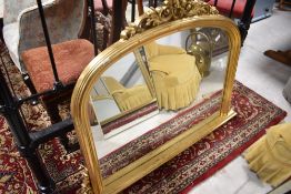 A modern reproduction gilt plastic over mantel wall mirror, approx 122 x 92cm