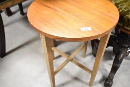 A vintage teak folding occasional table, top diameter 38cm