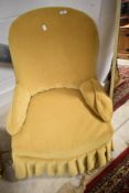 A vintage mustard dralon nursing chair