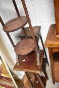 A selection of occasional furniture comprising folding cake stand, bed warming pan and two plant