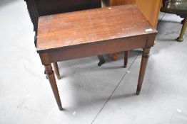 A vintage mahogany piano/organ stool and quantity of sheet music within