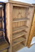 A modern rustic wood bookshelf, dimensions approx. Height 183 width 91 depth 34cm