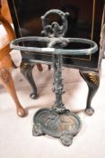 A traditional painted cast iron stick stand of naturalistic design, height approx. 58cm