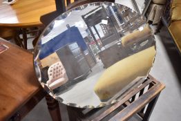 A vintage frameless wall mirror of oval form, approx. 76 x 50cm