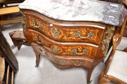 A French Bombe style chest having serpentine front with marble top , shaped legs and brass