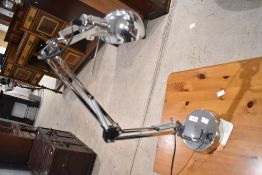 A modern chrome anglepoise lamp, in the vintage Herbert Terry style