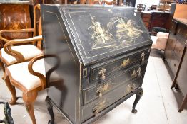 An Oriental style ebonised bureau with gilt heightened decoration, width approx. 76cm