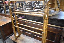 A Victorian stained frame towel rail ,width approx. 68cm