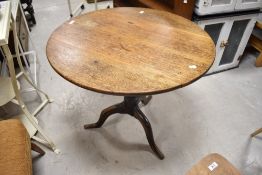 A 19th Century oak pedestal table having circular top, turned column and triple splay legs, diameter
