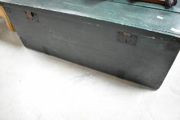 A traditional pine bedding box, overpainted in racing green, with heavy cast handles and added