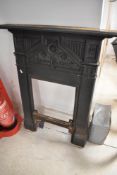 A traditional cast iron fire surround, in the Victorian style, internal dimensions 60 x 35cm,