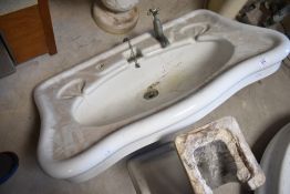Two late 19th or early 20th Century ceramic pedestal wash basin, and a similar bidet
