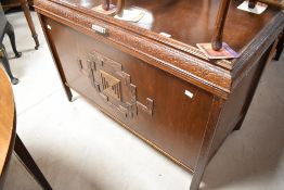 An early to mid 20th Century oak and ply bedding box having applique decoration and deco style