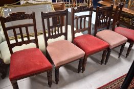 A harlequin set of five (three and two) Victorian mahogany dining chairs, having overstuffed seats