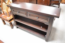 A modern hardwood bookshelf with two drawers over two fixed shelves, dimensions approx. Width 120