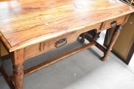 A modern hardwood side table having two frieze drawers and turned frame, dimensions approx. Width