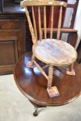 A 19th Century low seat kitchen chair and an early 20th Century circular coffee table