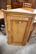A 19th Century stripped pine corner wall cupboard, height approx. 94cm