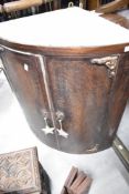 A traditional oak bow fronted corner wall cabinet, height approx. 77cm