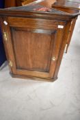 A period style oak corner wall cabinet of small proportions , height approx. 71cm