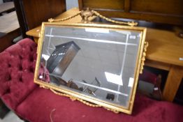 A vintage gilt frame wall mirror having urn and swag decoration , approx width 98cm