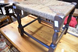 A vintage strung footstool