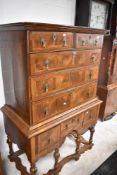 A nice quality walnut chest of two short and three long drawers having oyster veneer fronts,