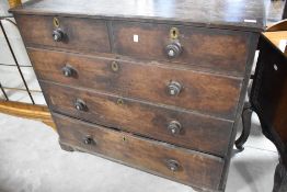 A Victorian mahogany chest of two over three drawers, having brass escutcheons and turned handles,