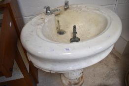 A Victorian ceramic pedestal wash basin stamped Doulton and CO Lambeth , on tulip style base, fitted