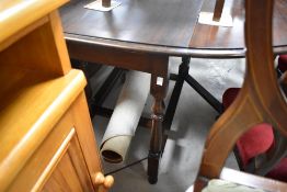 A mid 20th Century mahogany gateleg table having oval top