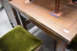 A mid 20th Century oak fold over kitchen table, closed size approx. 76 x 91cm