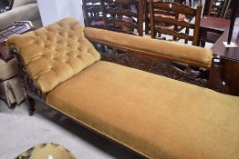 A Victorian chaise longue having mahogany frame and later ochre dralon upholstery, length approx.