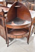 A 19th Century mahogany corner washstand, with Regency style handles and later glass top, height