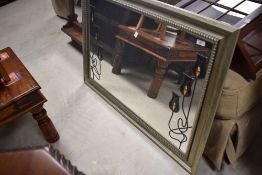 A modern wall mirror having Art Nouveau tube lined style decoration, approx. 72 x 101cm