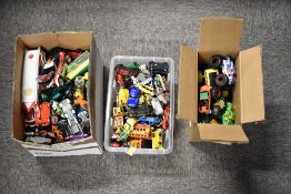 A large, unsorted collection of toy vehicles spanning several decades, contained within two